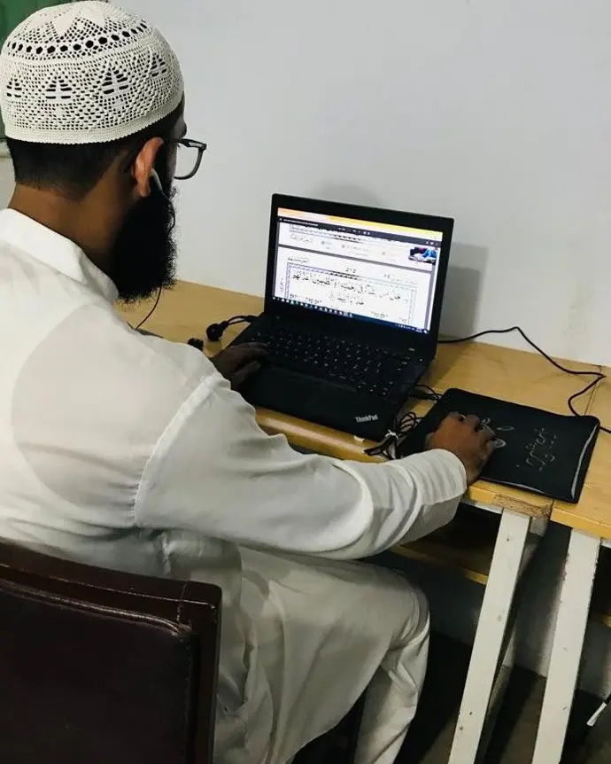 A skilled male Quran teacher at Naveed Islamic Center, delivering expert Quranic instruction and individualized support to students, ensuring comprehensive Islamic education and learning