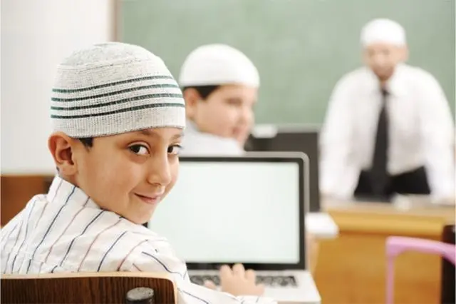 Child reciting Quran with Tajweed